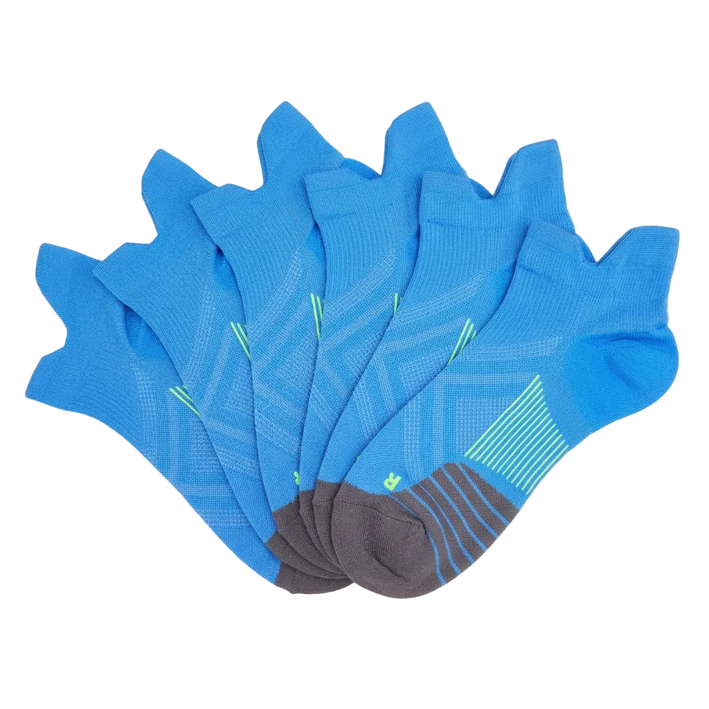 Six blue no-show ankle compression socks overlapping in a fan arrangement with lime stripes and charcoal toes